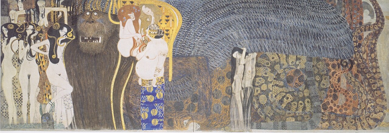 A huge gorilla-like creature and pale female figures appear among gold and dark patterns in The Hostile Powers section of Klimt’s Beethoven Frieze.