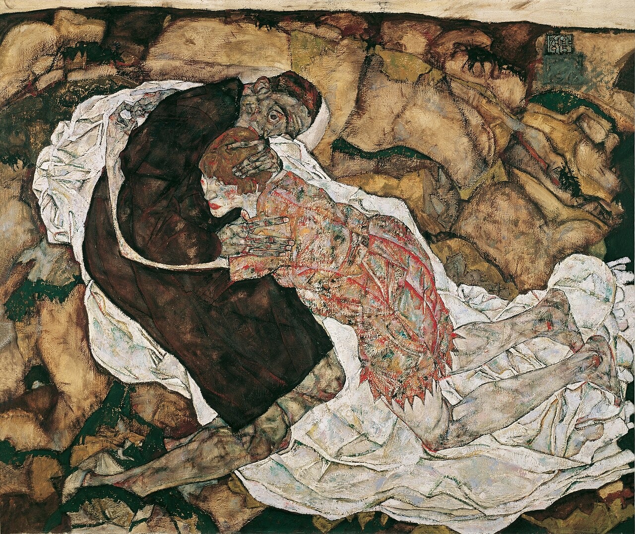 Two figures in a tense embrace crouch over a crumpled white cloth on bare rocky ground.