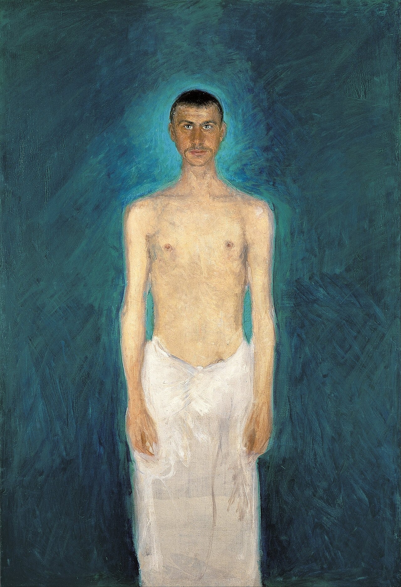 A slender bare-chested man in a pale loincloth faces forward against a blue background.