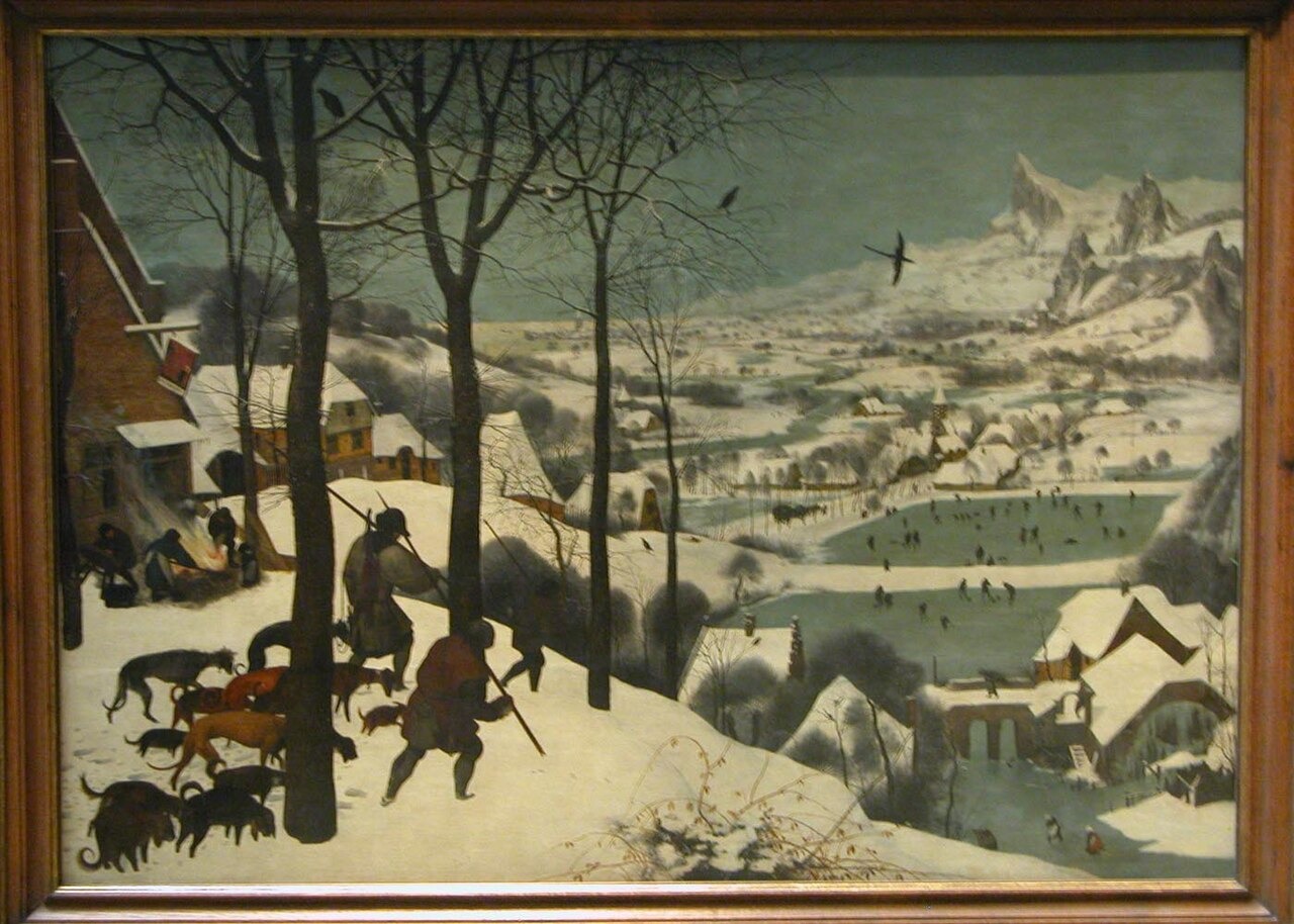 Hunters and their dogs descend a snowy slope above frozen ponds, a village and distant mountains.