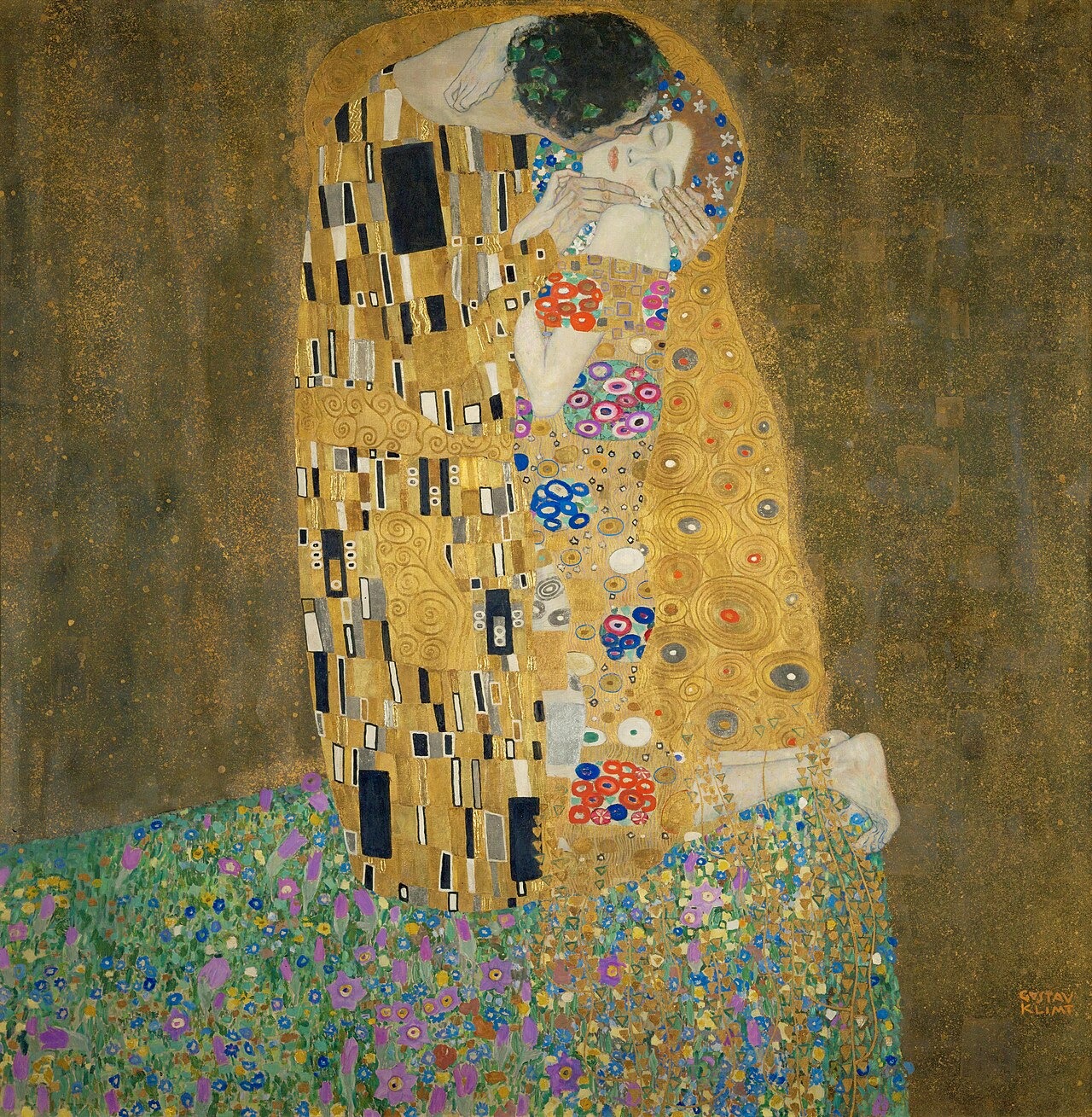 Two lovers wrapped in gold patterned robes embrace on a flower-covered patch of ground.