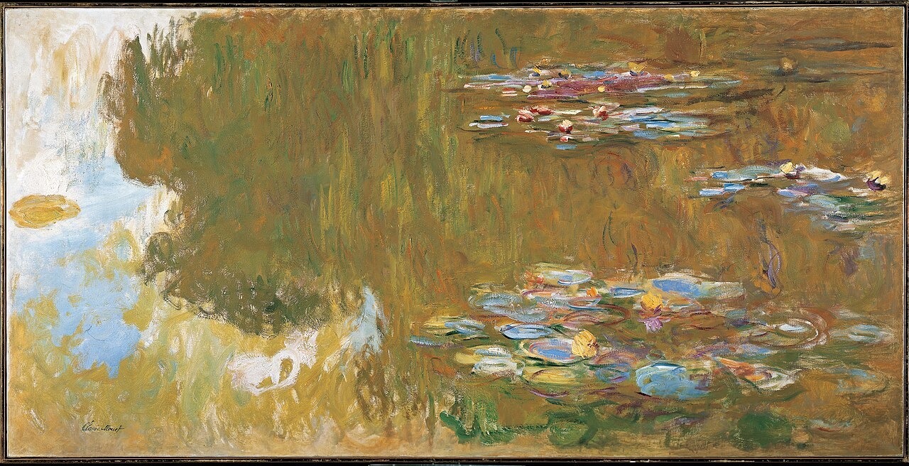 Pink water lilies and green leaves float over blue, purple and warm-coloured reflections in a pond.