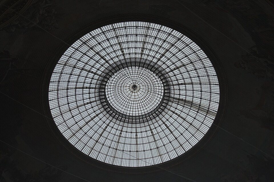 Circular glass-and-iron dome of the Bourse de Commerce seen from below