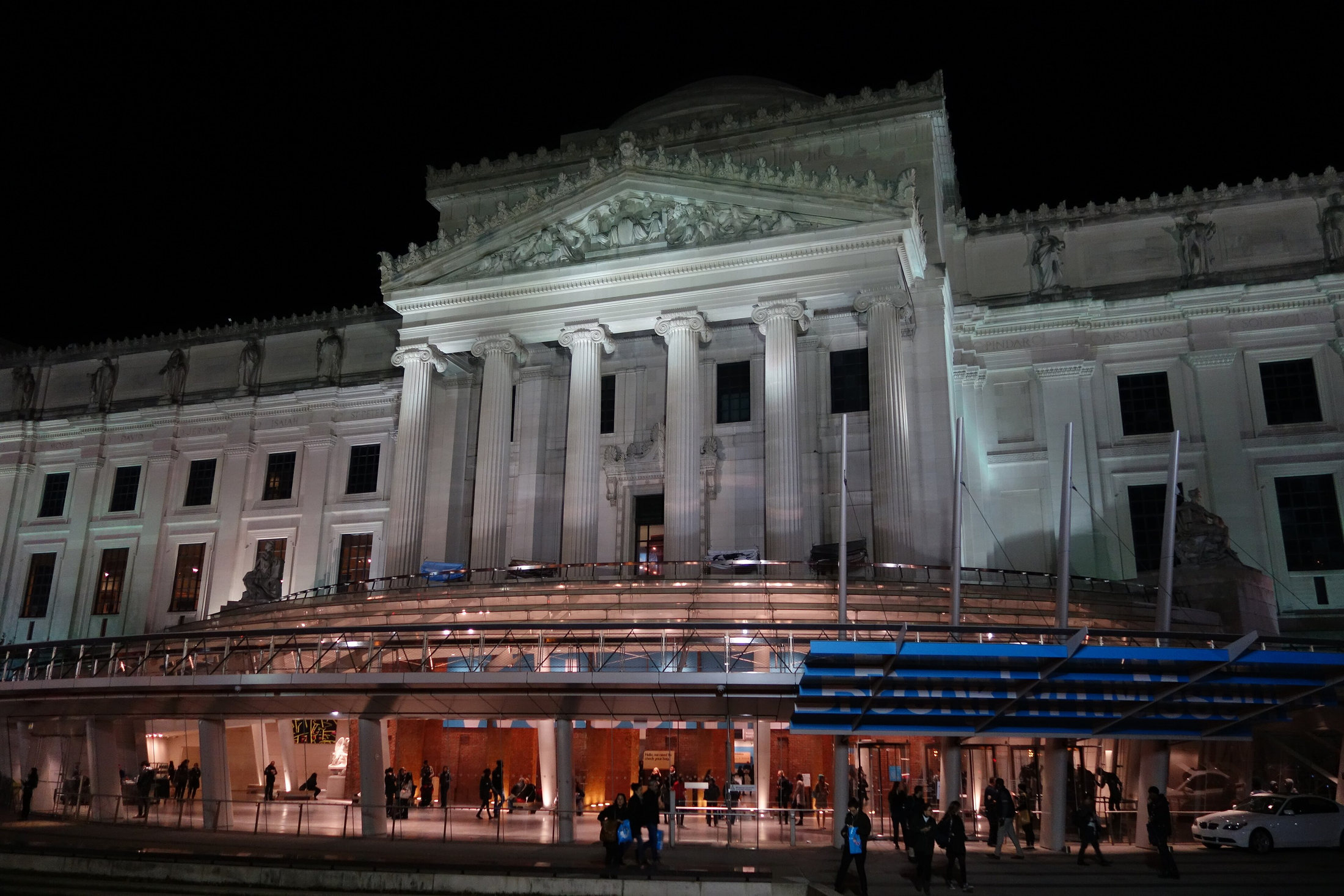 Brooklyn Museum façade and illuminated glass entrance at night