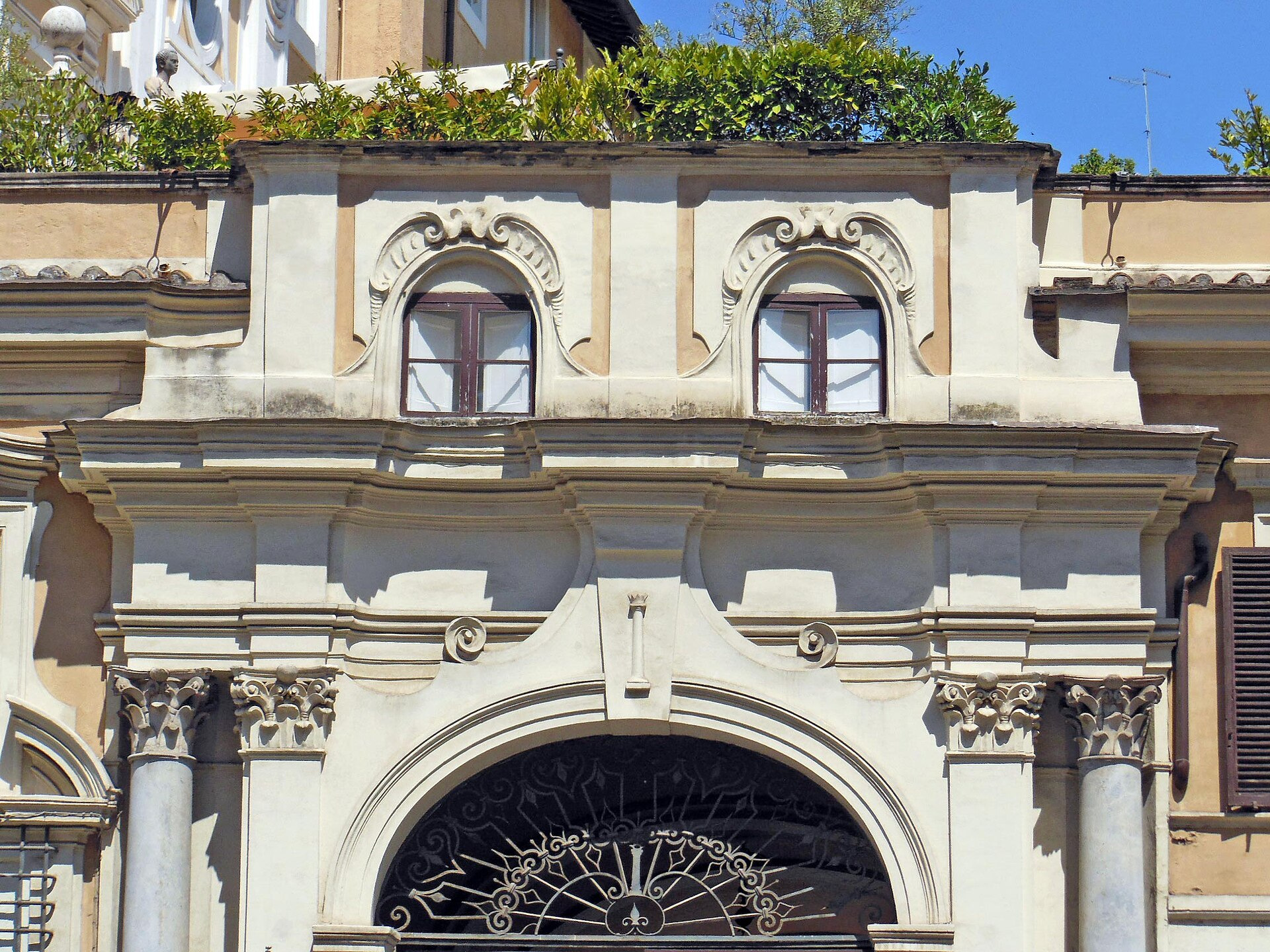Pale yellow and white historic façade details on Palazzo Colonna