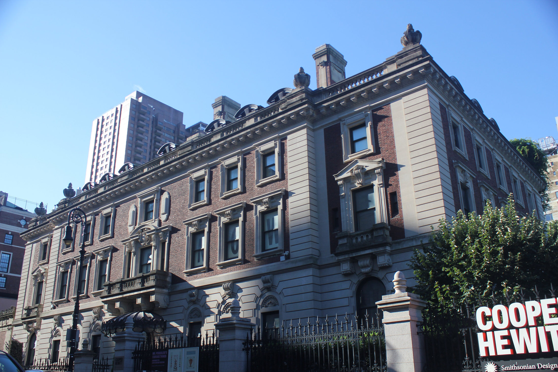 Cooper Hewitt’s Carnegie mansion exterior with its museum sign