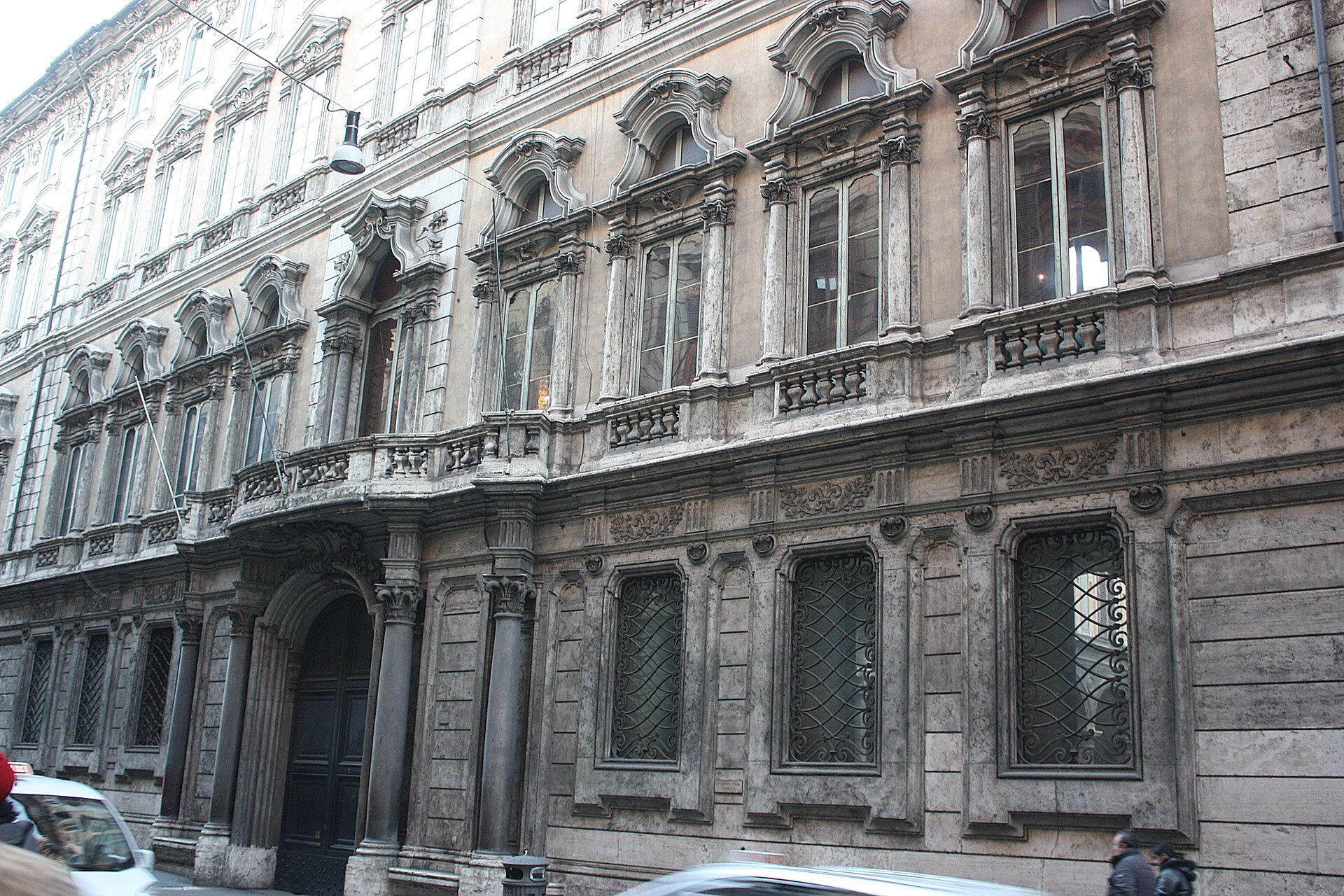 Baroque stone façade of Palazzo Doria Pamphilj seen from Via del Corso