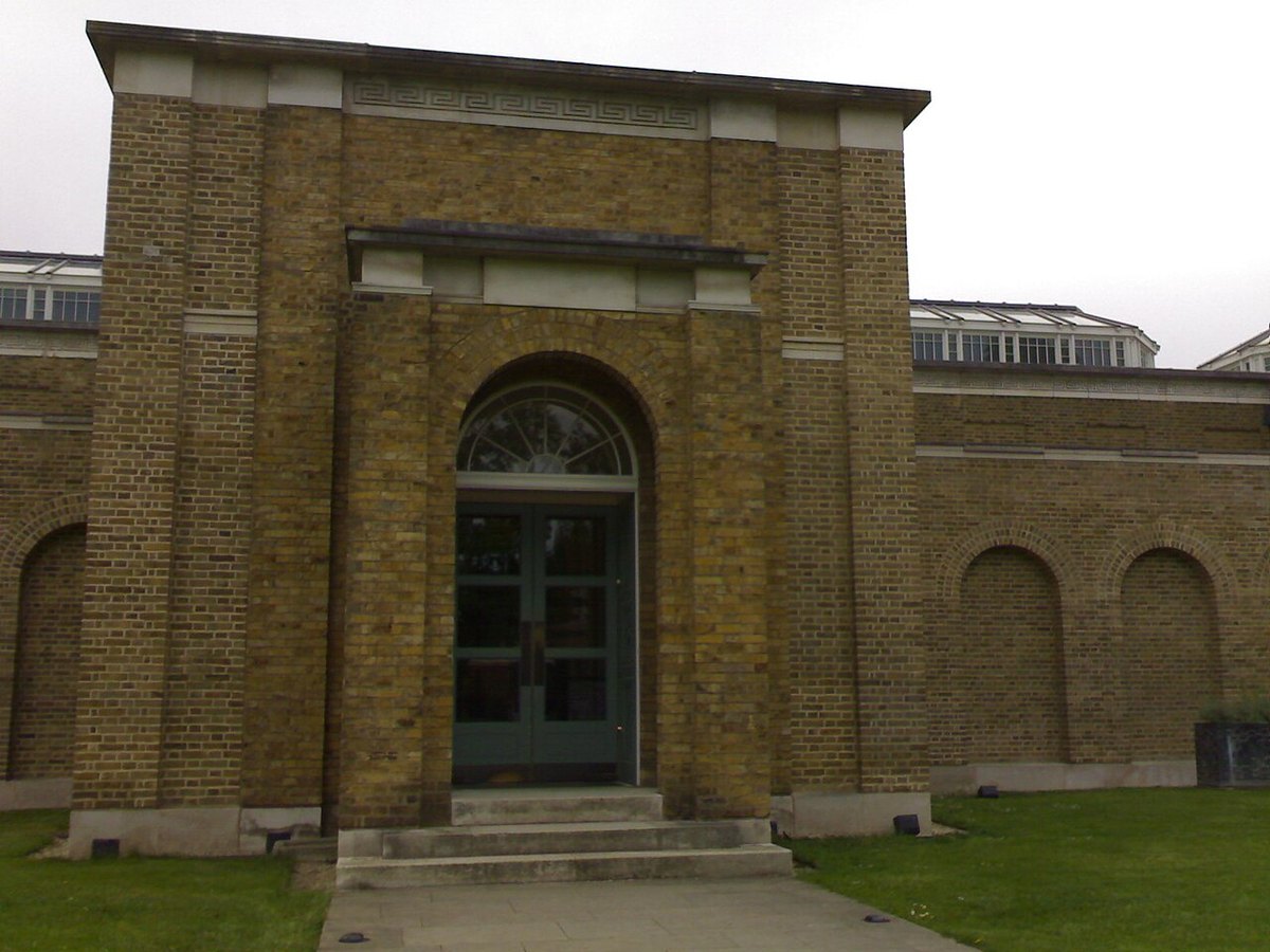 An arched doorway in the brick exterior of Dulwich Picture Gallery.