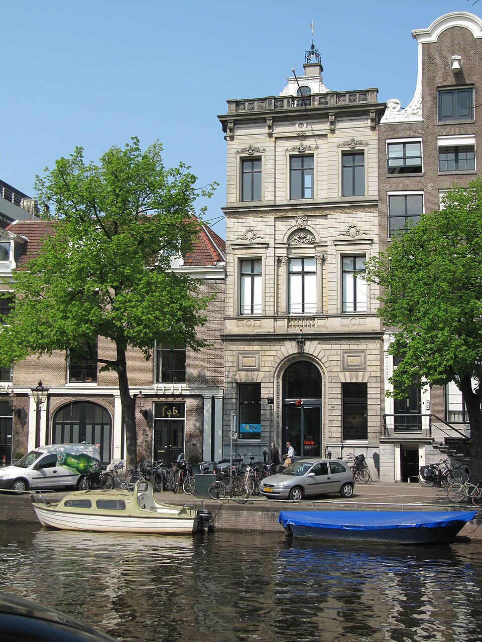 Foam’s historic Museum Fodor façade on Keizersgracht with a boat in the canal