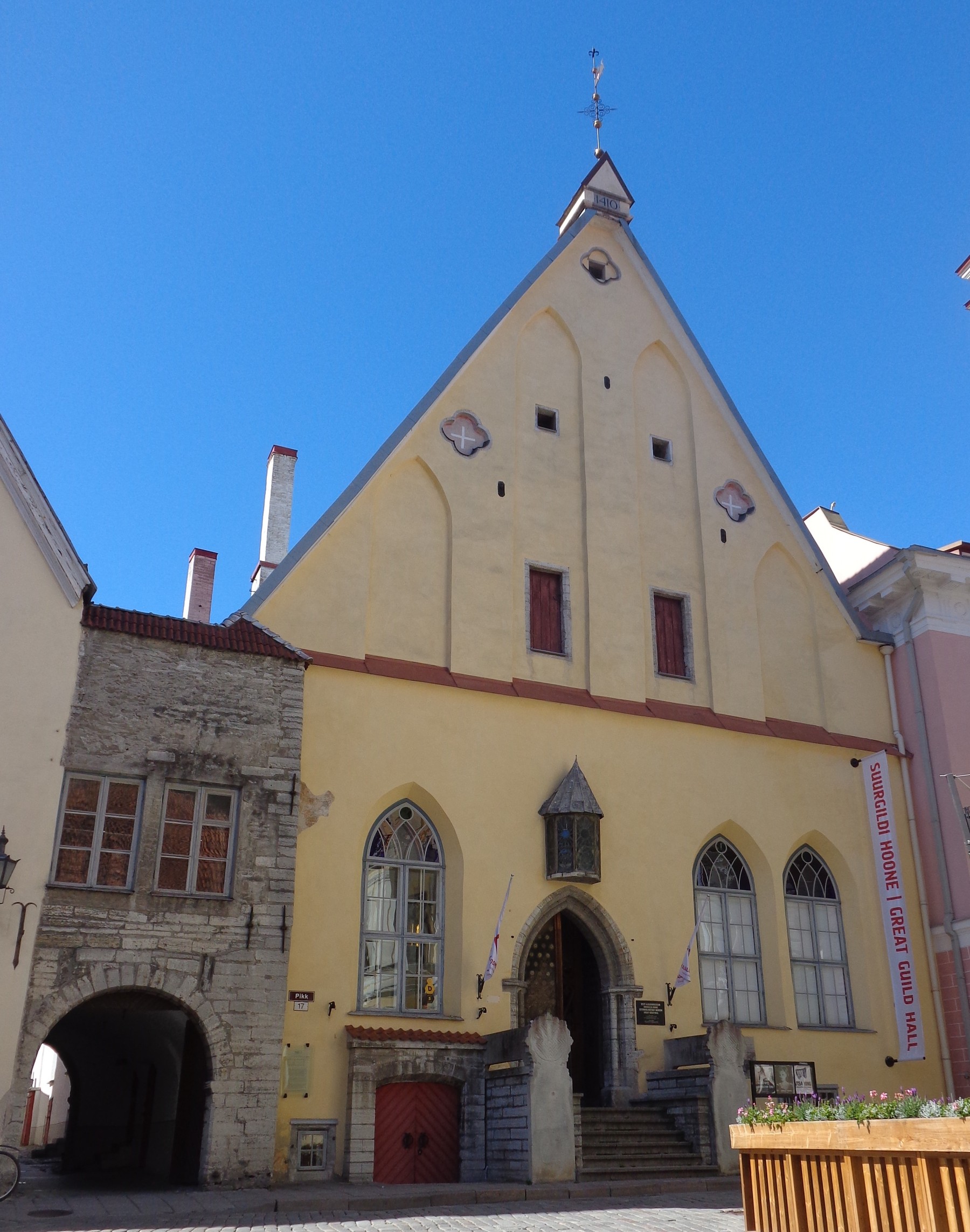 The pointed yellow gable and Gothic portal of Tallinn’s Great Guild Hall.