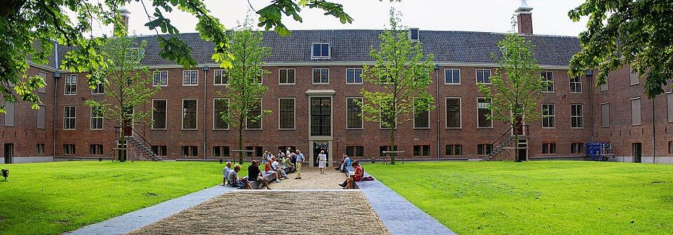Historic brick courtyard and lawn at the Amstelhof, now home to H’ART Museum