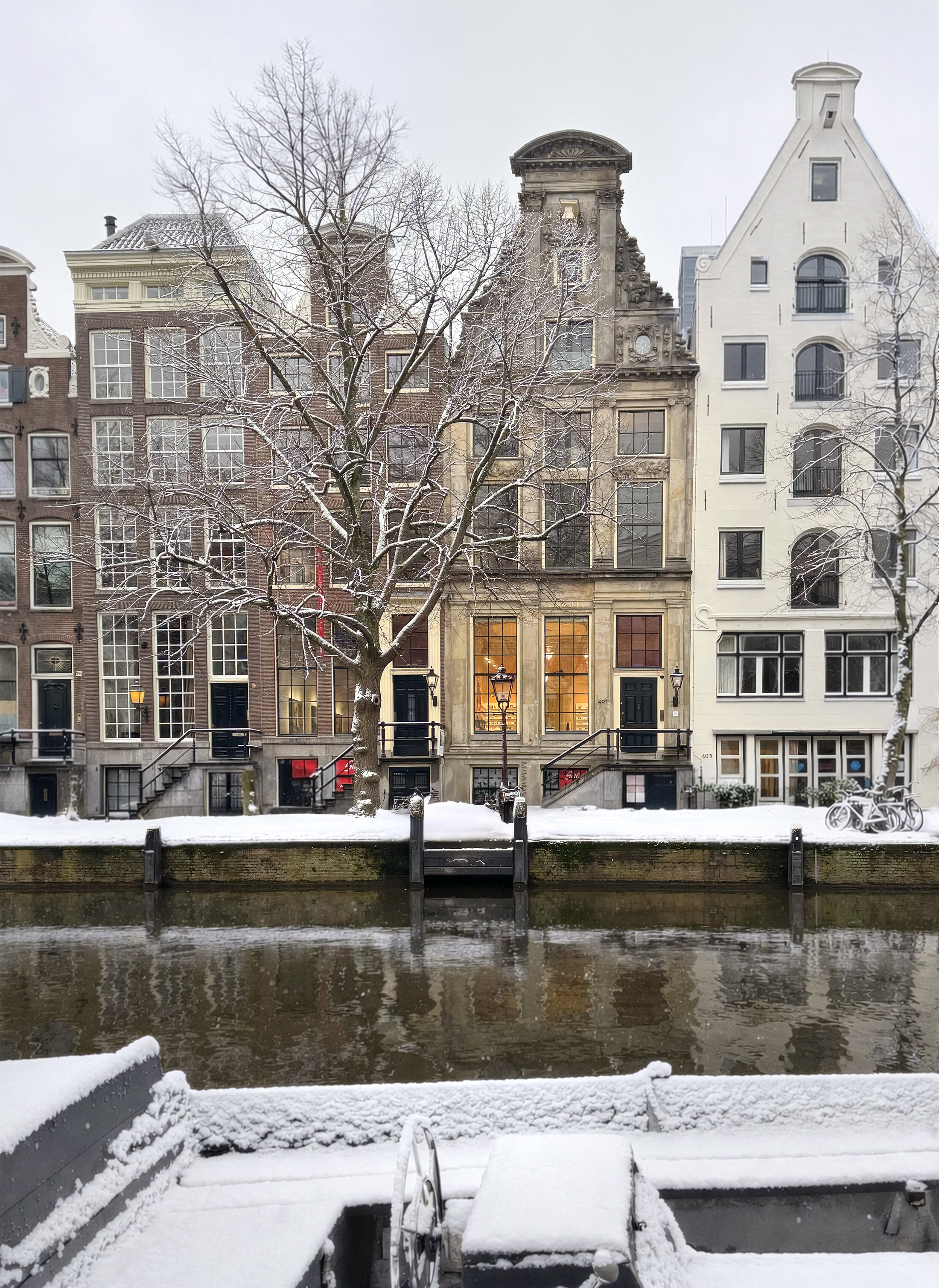 Huis Marseille’s historic canal-side façades seen across Keizersgracht in winter