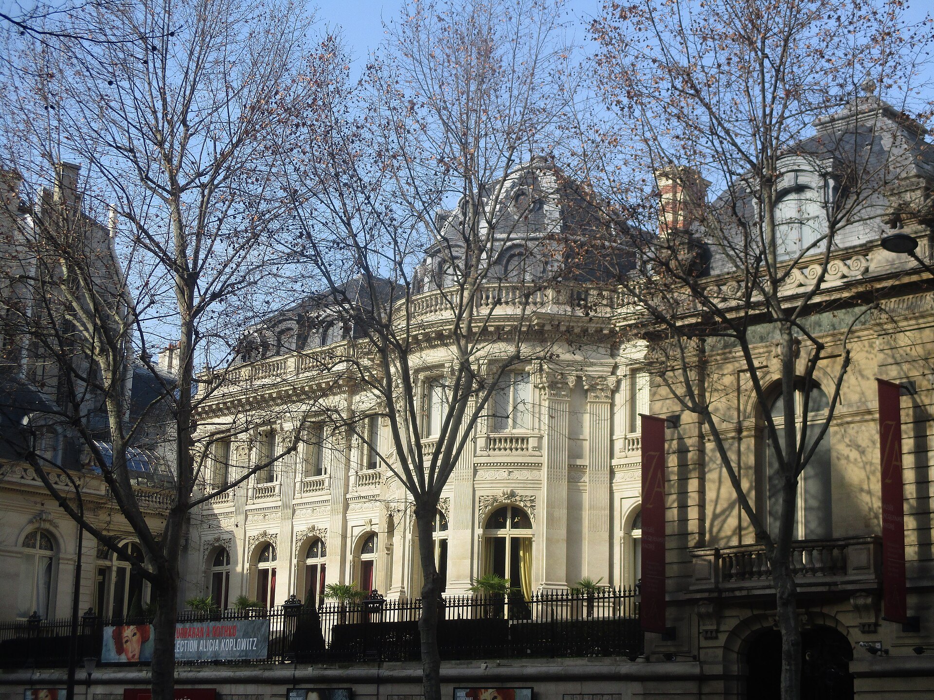 Musée Jacquemart-André’s ornate stone façade behind leafless trees on boulevard Haussmann