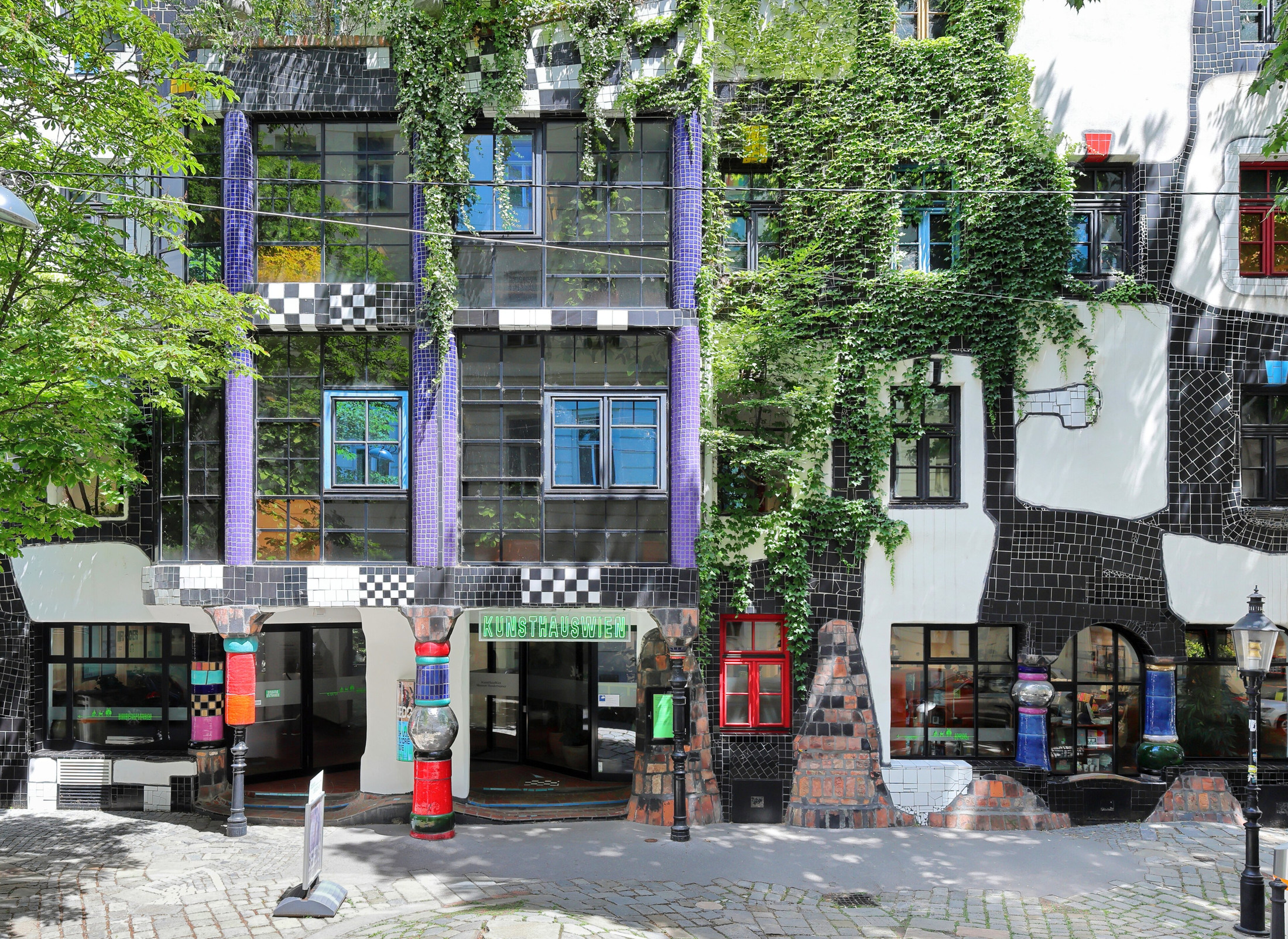The irregular windows and black-and-white tiles of Kunst Haus Wien