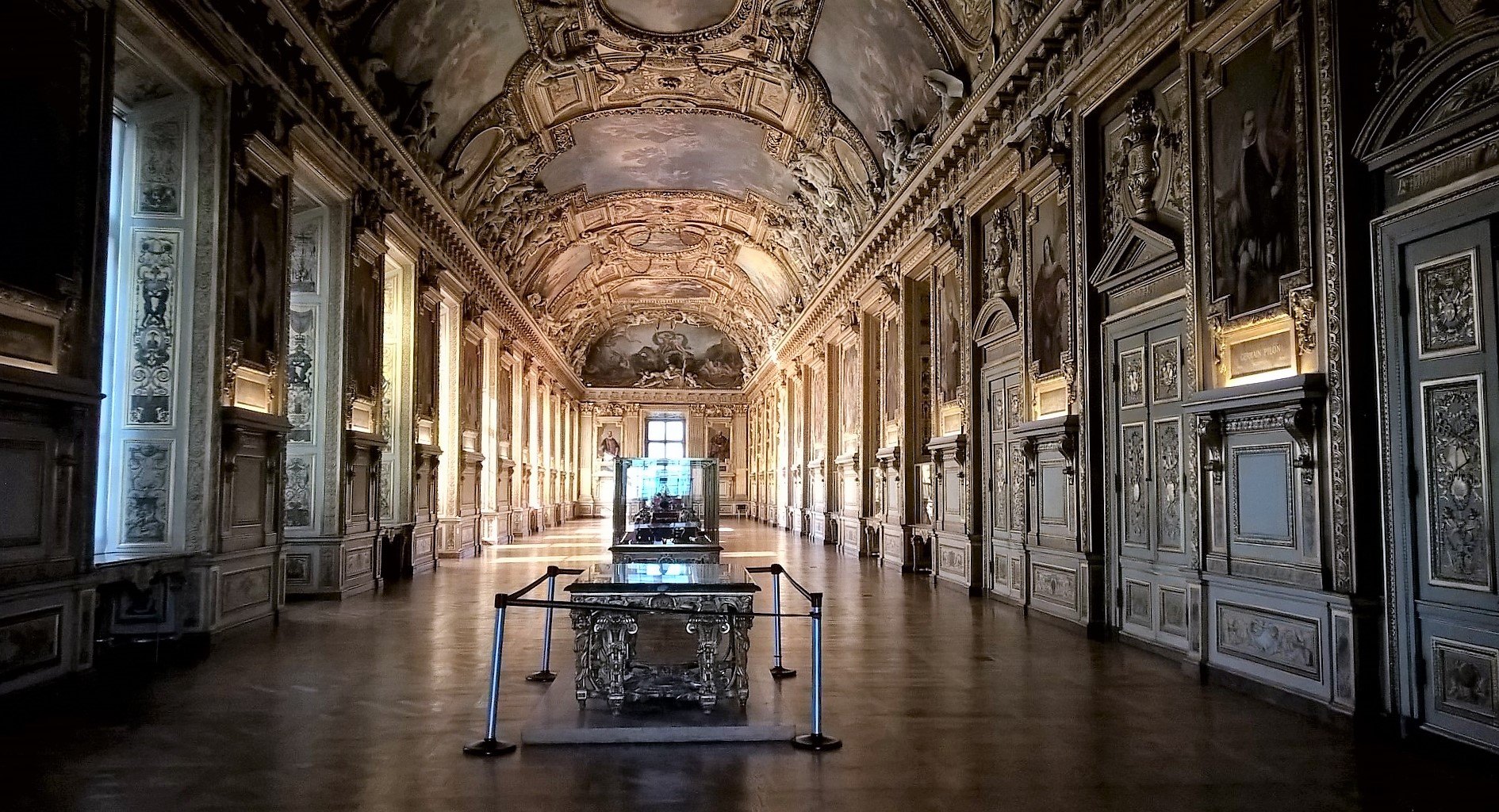 The Louvre’s empty Galerie d’Apollon, with a richly painted vaulted ceiling and gilded walls