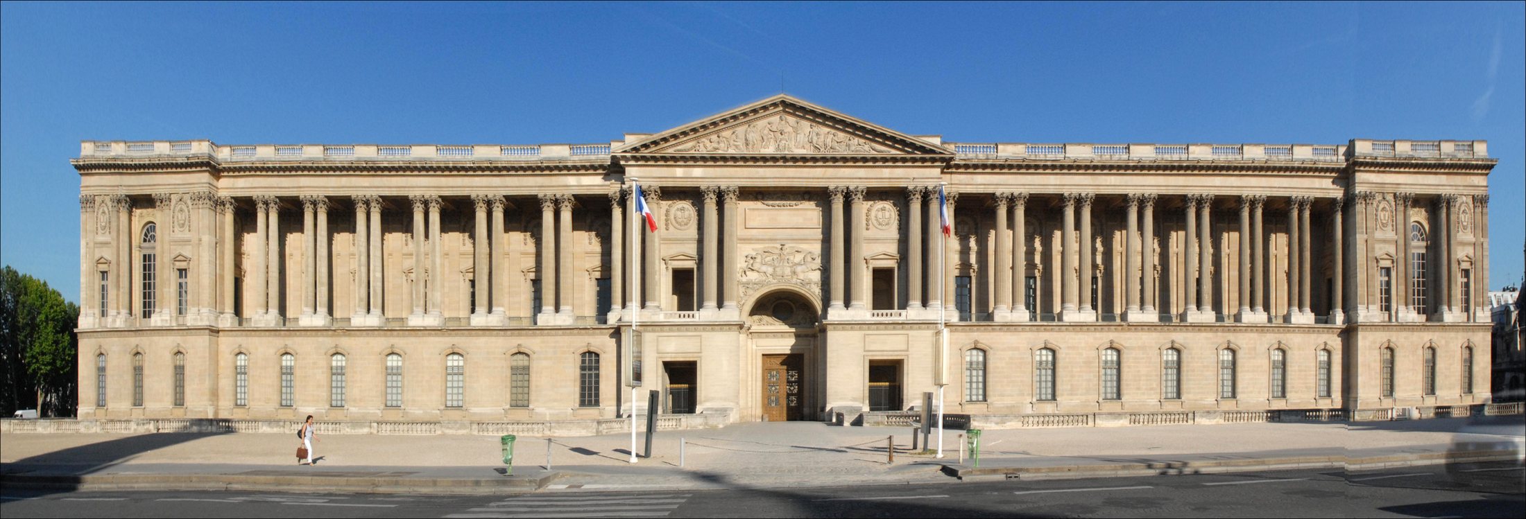 The Louvre’s eastern colonnade beneath a clear blue sky