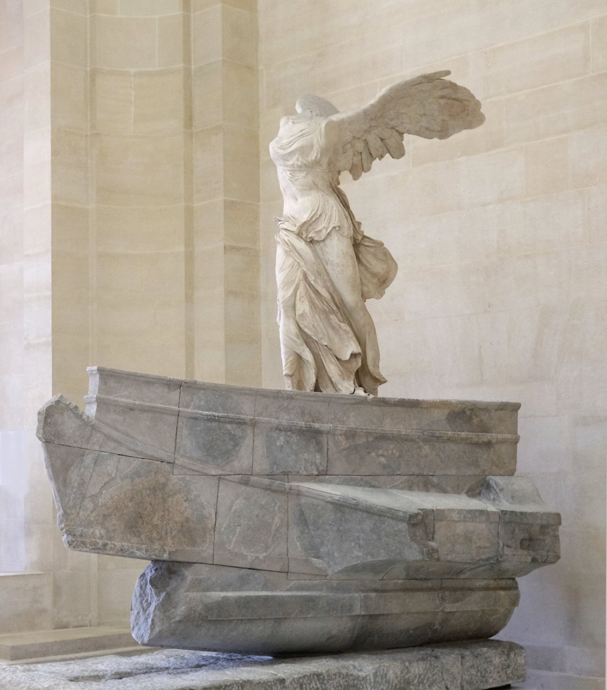Winged Victory of Samothrace on its stone ship-shaped base at the Louvre