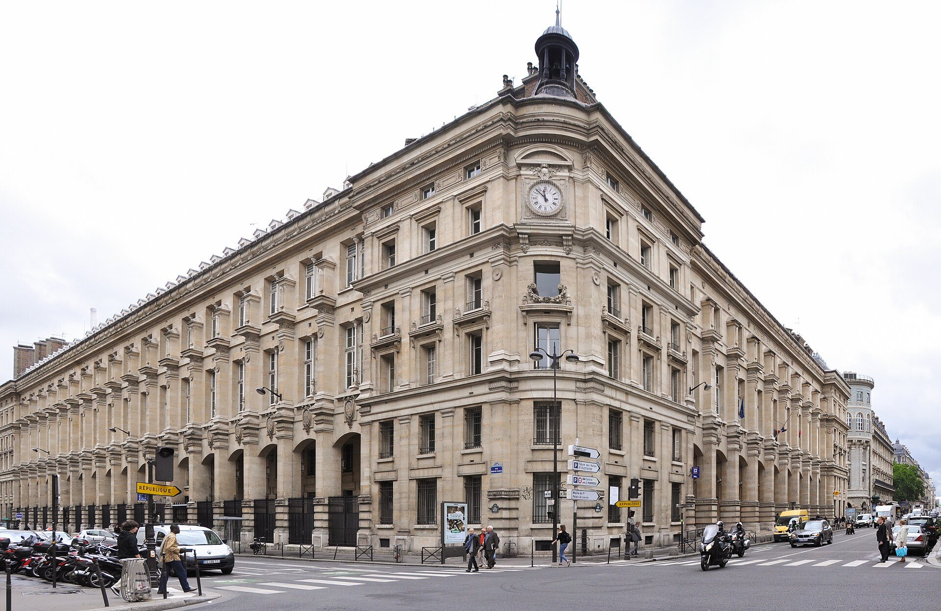The long stone facade of the Louvre Post Office building on rue du Louvre.