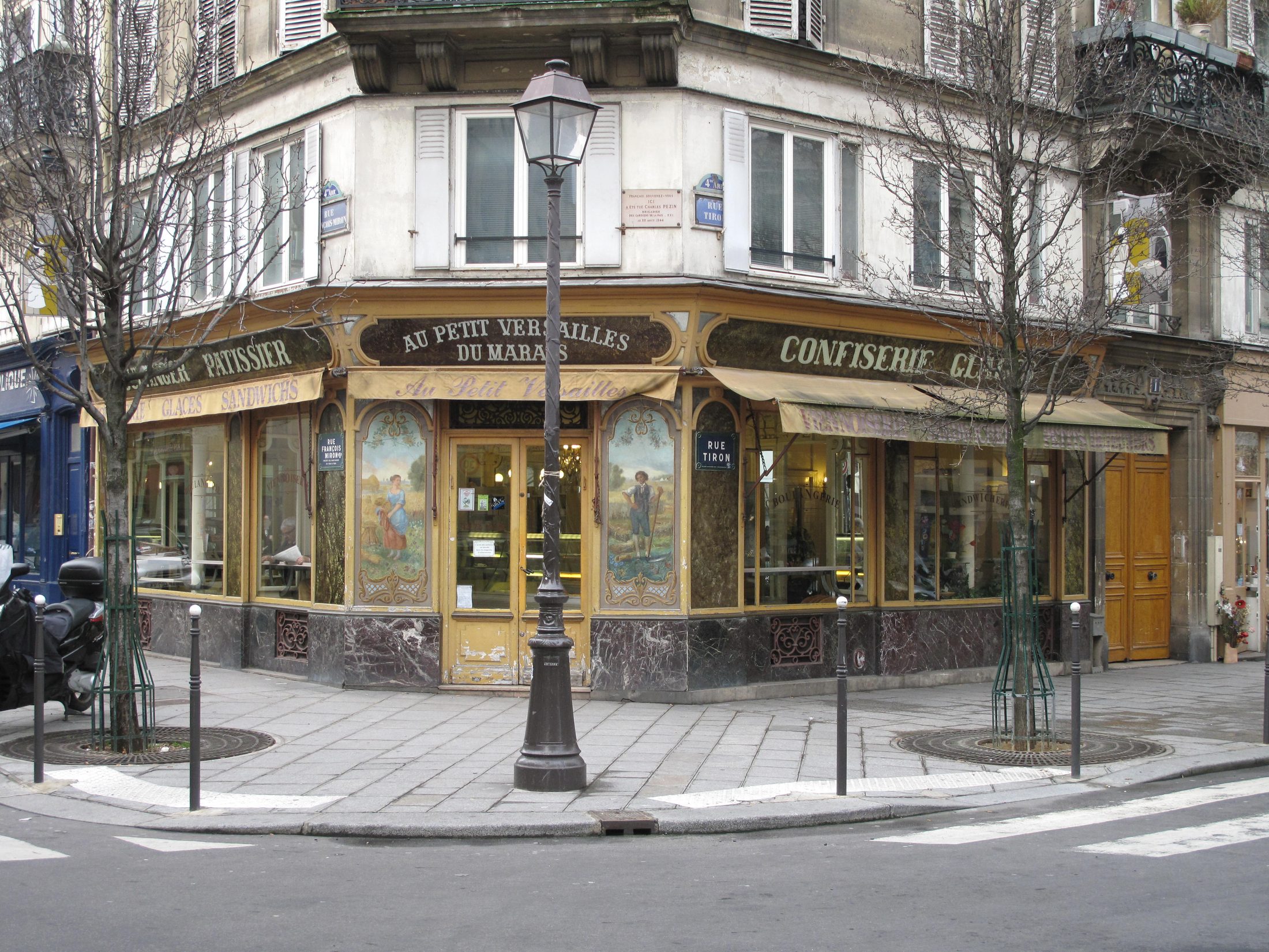 Historic painted bakery shopfront at the corner of rue Tiron and rue François-Miron in the Marais, Paris