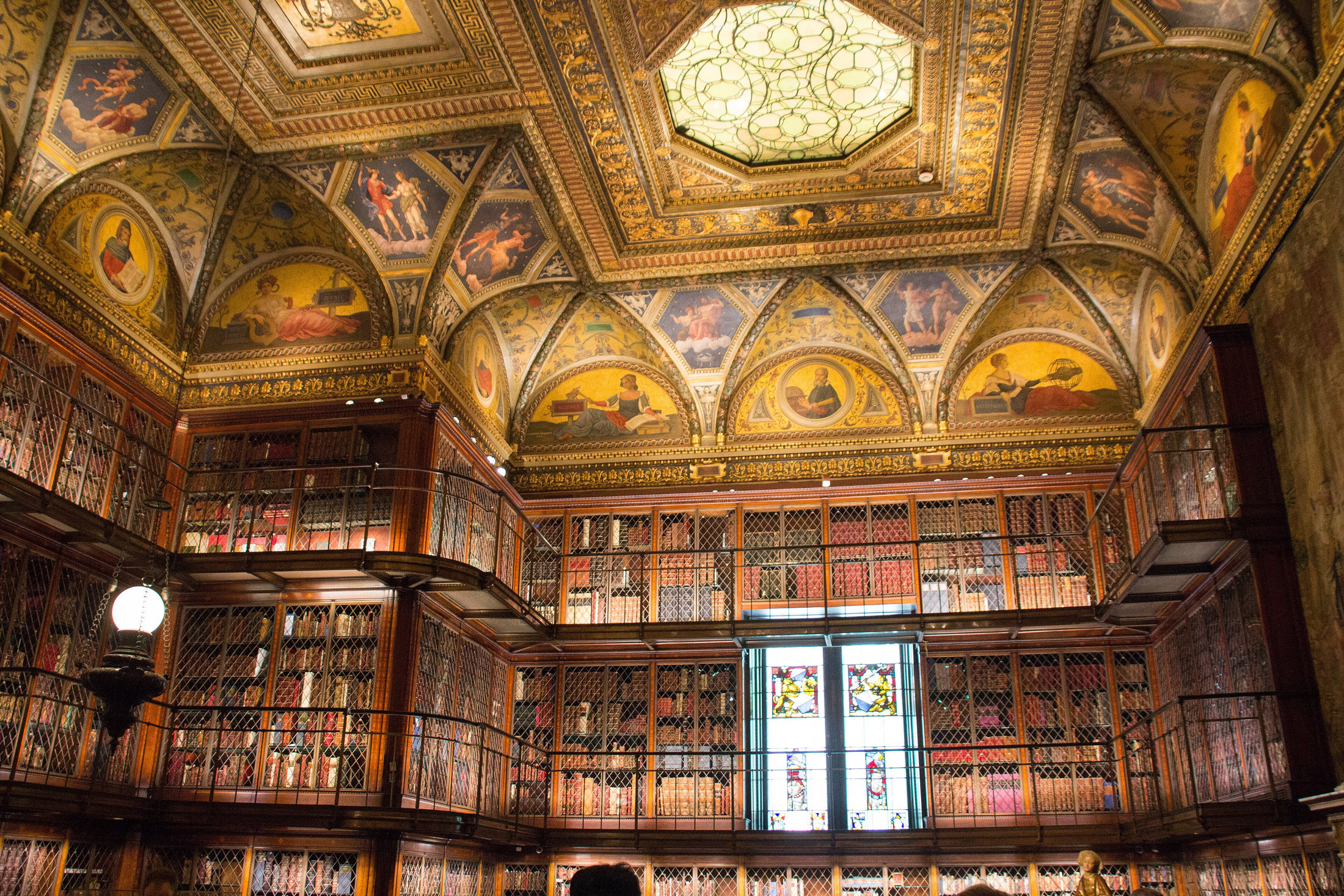 Inlaid walnut bookcases and painted ceiling in the Morgan’s historic East Room