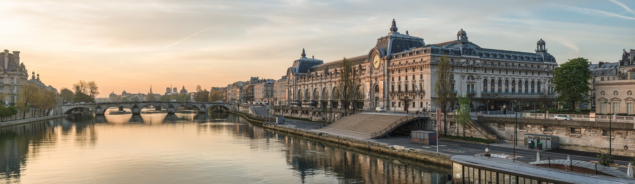 Musée d’Orsay and Pont Royal reflected in the Seine in warm early-morning light