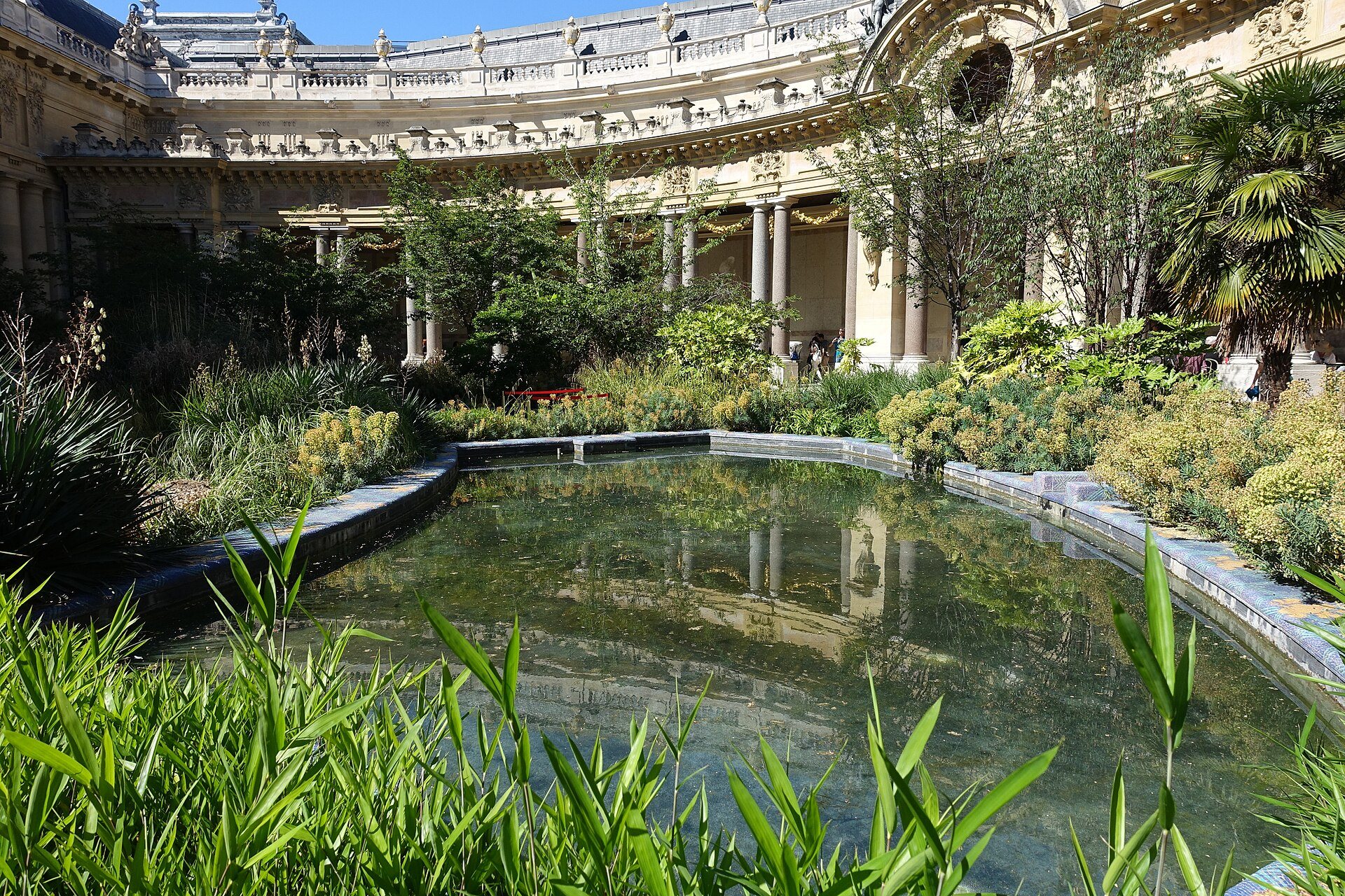 A reflecting pool and greenery in the Petit Palais’s arcaded garden