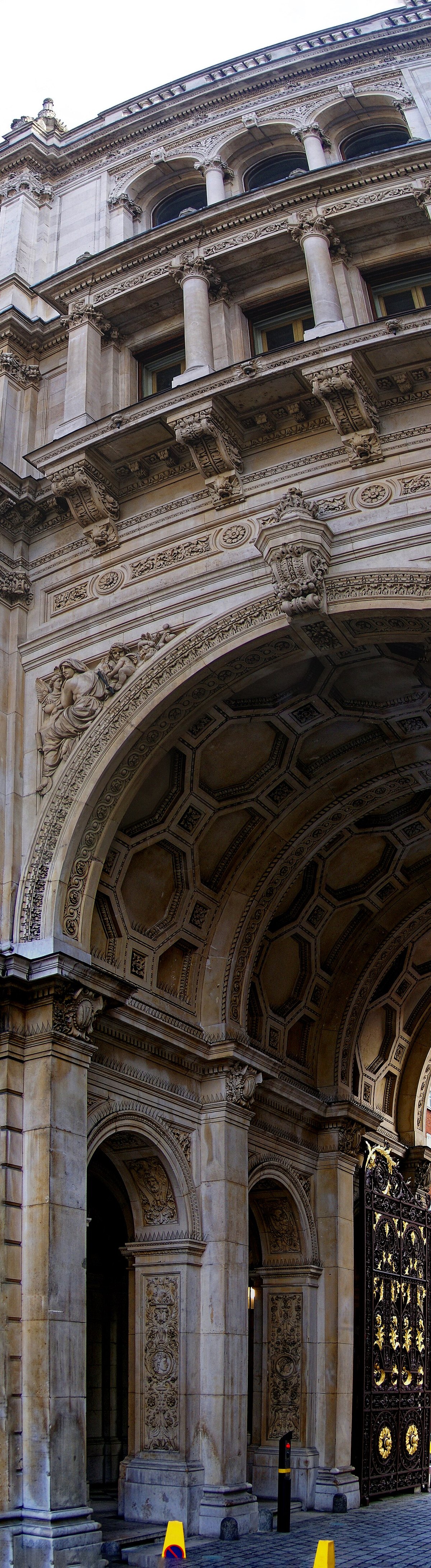 A tall view of the decorated Royal Academy entrance arch.