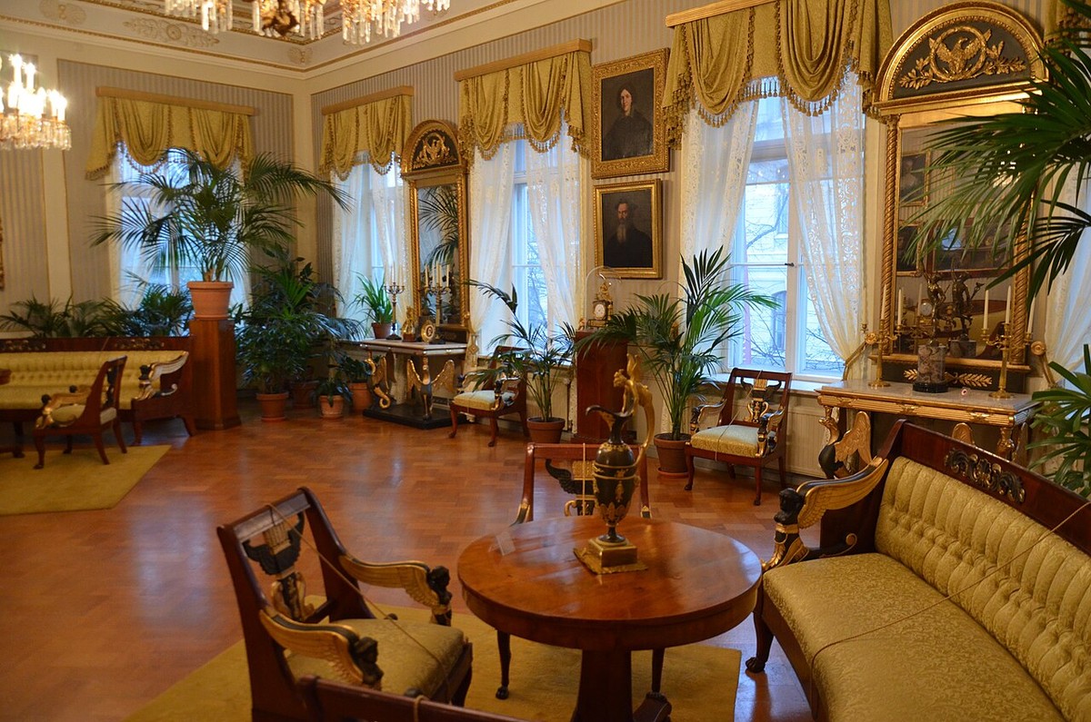 Historic furniture, gilded frames and tall windows in the Sinebrychoff house museum.