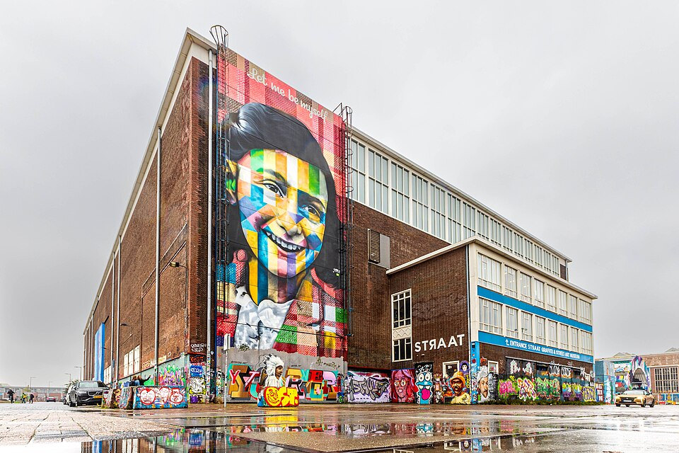 STRAAT Museum’s former welding warehouse with Eduardo Kobra’s Anne Frank mural on its steel doors