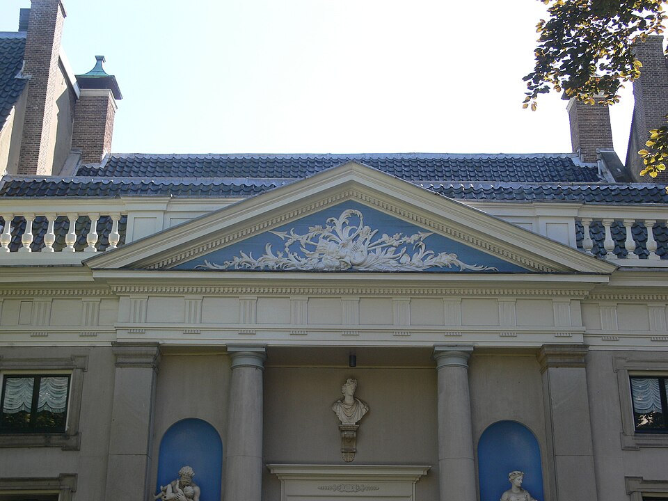 Classical pediment and blue niches on Museum Van Loon’s historic coach-house garden façade
